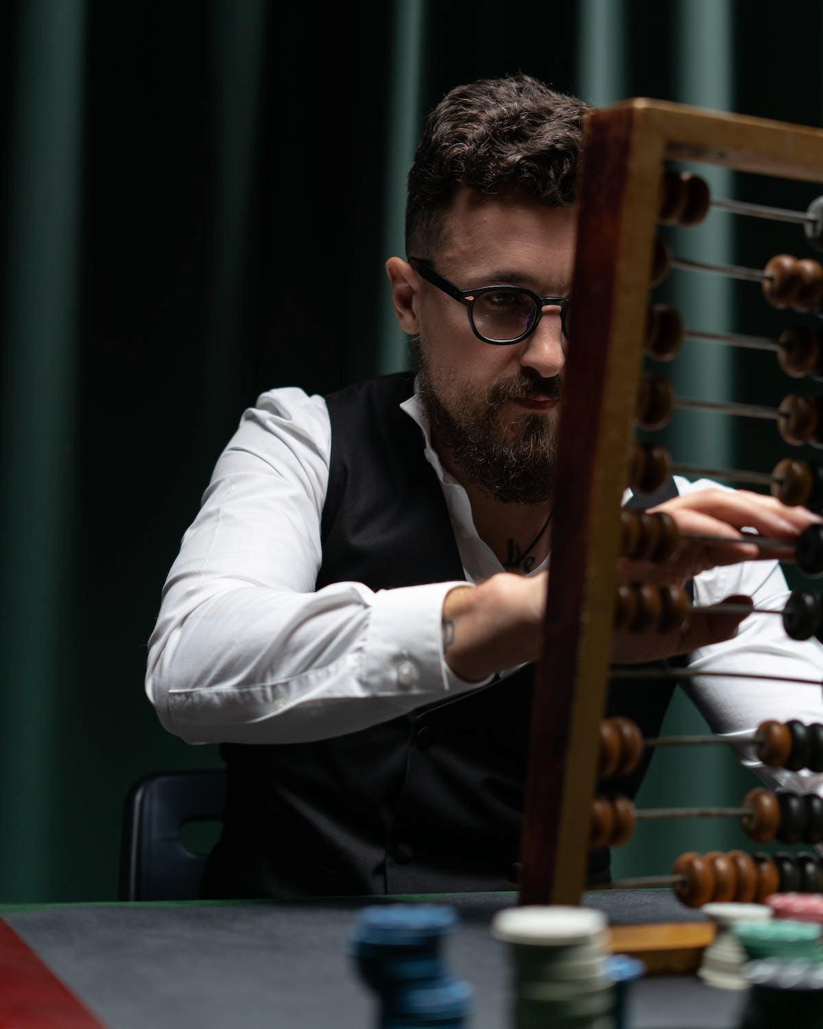 Man using abacus to calculate.